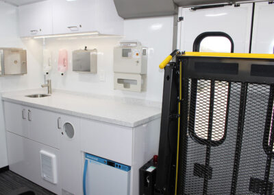 Wheel-Chair Lift inside the Mobile Treatment Unit beside a nurse station.
